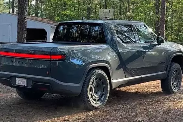 Rivian R1T's Quirky Feature: 'Carolina Squat' Achieved Through Camp Mode